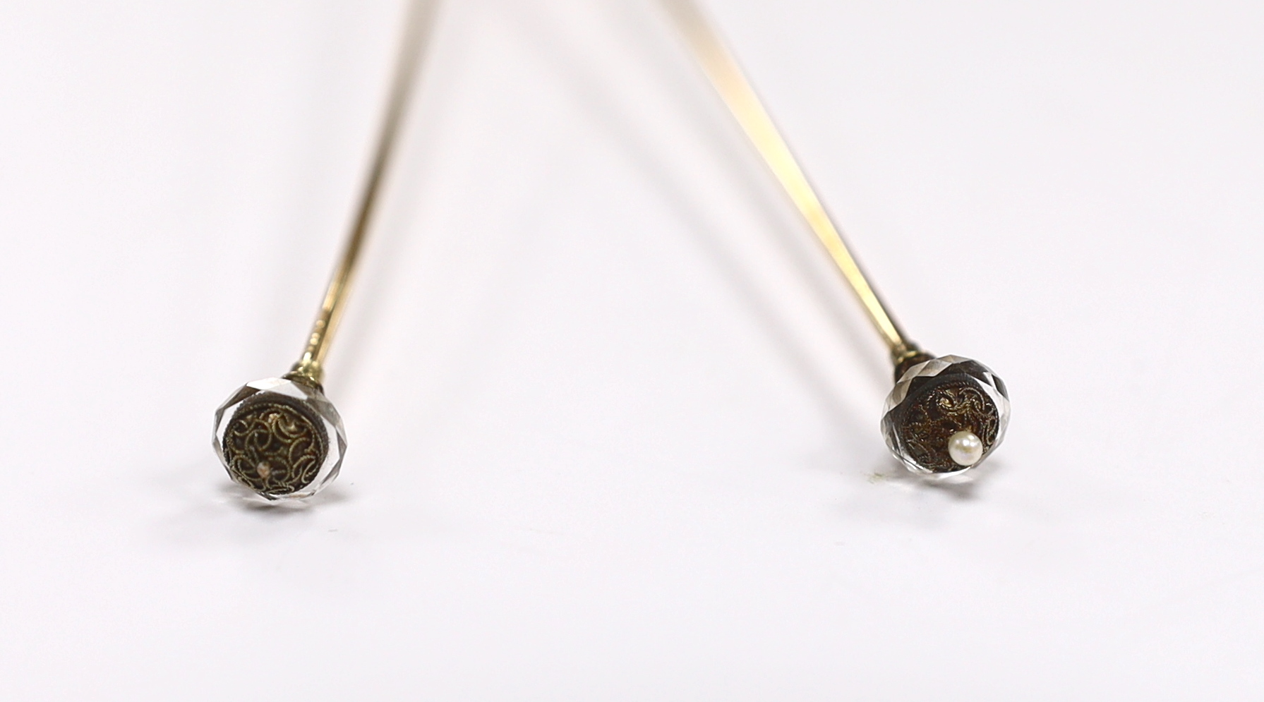 A pair of seed pearl set 'filled pin' hatpins, one a.f.